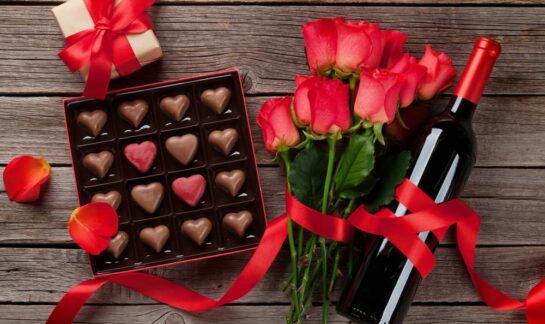 heart-shaped chocolates, roses and bottle of wine